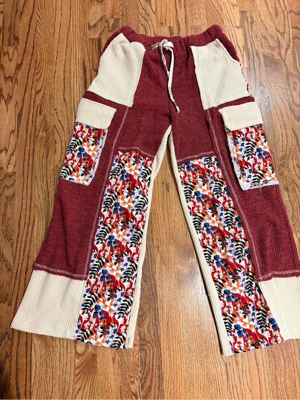NWOT POL women’s Burgundy and Cream Patchwork Pants with floral detail